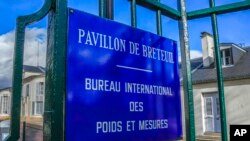 The entrance of the International Bureau of Weights and Measures is pictured in Sevres, outside Paris, Nov. 17, 2022. 