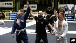 Ukrainian amputees perform in a national jiujitsu competition in Kyiv, Oct. 29, 2023. Some war veterans have learned to cope with the trauma of losing limbs by practicing a Brazilian form of jiujitsu.