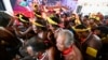 Brazilian Indigenous people celebrate after Brazil's Supreme Court ruled against efforts to restrict native peoples' rights to reservations on their ancestral lands in Brasilia on Sept. 21, 2023. 