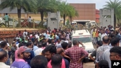 People gather outside following a blast at the Zamra convention center in Kalamassery, a town in Kochi, southern Kerala state, India, Oct.29, 2023.