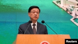 Hong Kong Chief Executive John Lee speaks during a press conference, in Hong Kong, May 14, 2024.