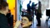 Sparta gets makeup during a photo shoot in Rome, Tuesday, Feb. 7, 2023.
