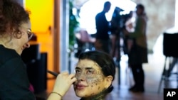 Sparta gets makeup during a photo shoot in Rome, Tuesday, Feb. 7, 2023.