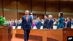 General To Lam walks to the podium to swear in as the Vietnamese president at the National Assembly in Hanoi, Vietnam, May 22, 2024. 