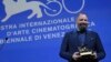 Greek director Yorgos Lanthimos poses with the Golden Lion award for the best film 'Poor Things' during the closing ceremony for the 80th edition of the Venice Film Festival in Venice, Italy, Sept. 9, 2023.