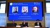 Hans Ellegren (center), Permanent Secretary of the Royal Swedish Academy of Sciences, announces the winners of the 2023 Nobel Prize in Chemistry during a press conference at the Royal Swedish Academy of Sciences in Stockholm, Sweden, Oct. 4, 2023.