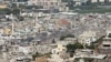 Smoke rises from Ain el-Hilweh Palestinian refugee camp during Palestinian faction clashes, in Sidon, Lebanon, Sept. 11, 2023.