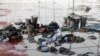 Sejumlah barang milik orang-orang yang mengikuti acara keagamaan di lokasi terjadinya insiden yang mengakibat ratusan orang tewas terinjak-injak di Uttar Pradesh, India, Rabu, 3 Juli 2024. (Foto: Anushree Fadnavis/Reuters)