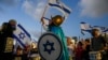 Israelis protest against plans by Prime Minister Benjamin Netanyahu's government to overhaul the judicial system in Tel Aviv, Israel, Sept. 9, 2023. 