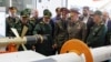 Russian Defense Minister Sergei Shoigu listens to Amirali Hajizadeh, commander of the Islamic Revolutionary Guard Corps' Aerospace Force, as they visit an aerospace industry exhibit in Tehran, Iran, Sept. 20, 2023. (Russian Defense Ministry via Reuters)