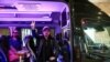 Maksim Andryushchenko dan Igor Bortnik, anggota dari grub band rock Bi-2. duduk di dalam kendaraan setelah tiba di Bandara Internasional Ben Gurion di Lod, Israel, dari Thailand pada 1 Februari 2024. (Foto: Reuters/Tomer Appelbaum)