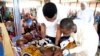 FILE - Health officials attend to children suffering malnutrition in a clinic set up by health authorities in collaboration with Medecins Sans Frontieres or Doctors Without Borders (MSF) at Mashi council of Katsina State, northwest Nigeria, July 22, 2022.