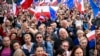 People cheers during a march to support the opposition against the governing populist Law and Justice party in Warsaw, Oct. 1, 2023. 