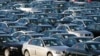 FILE - Imported German-made BMWs are parked at the North East Auto Terminal, Oct. 23, 2008, in Jersey City, New Jersey. BMW and two other automakers have used parts from a Chinese supplier banned in the U.S. for forced labor, congressional investigators said.