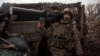 A Ukrainian service member holds an anti-drone rifle in a trench at a position outside the frontline town of Horlivka, amid Russia's attack on Ukraine, in Donetsk region, Ukraine, March 1, 2023. 