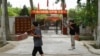 FILE - This picture taken July 17, 2023, shows the facade of the headquarters of the Chinese Communist Party, in Aral Mehelle village, outside Yarkant in northwestern China's Xinjiang region. 