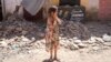 A child reacts after inspecting the damage caused by the earthquake, in her town of Amizmiz, near Marrakech, Morocco, Sept. 10, 2023. 