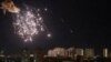 An explosion of a drone is seen in the sky over the city during a Russian drone strike in Kyiv, Ukraine, Sept. 10, 2023. 