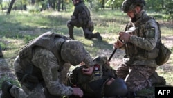 Ukrainian servicemen take part in medical training near the town of Kurakhove, Donetsk region, Oct. 12, 2023, amid Russia's invasion of Ukraine. 