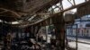 FILE - People clear the rubble of a market destroyed in a rocket attack the day before in Kostiantynivka, Ukraine, Sept. 7, 2023. 