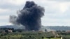 Smoke billows after an Israeli strike on the southern Lebanese border village of Tayr Harfa on April 6, 2024.