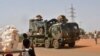 A French Army military vehicle belonging to a convoy of French troops is seen crossing the Lazaret district in Niamey, Niger, Oct. 10, 2023.