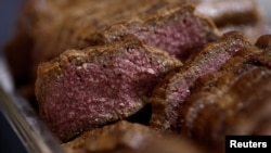 FILE - Pieces of 3D printed plant-based vegan meat, produced by Israeli startup Redefine Meat, are displayed at SIAL food and innovation exhibition in Villepinte, near Paris, Oct. 19, 2022.