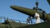 FILE - Russian troops load an Iskander missile onto a mobile launcher during drills at an undisclosed location in Russia, in this photo released by Russian Defense Ministry Press Service, Feb. 2, 2024.