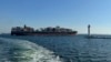 FILE - A ship leaves the port of Odesa, Ukraine, Aug. 16, 2023, to proceed through a temporary corridor for merchant vessels. On Saturday, two vessels became the first ships to use a temporary corridor to sail into Black Sea ports and load grain for African and Asian markets.