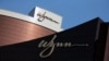 FILE - Company logos are displayed at Wynn Macau resort in Macau, China, Feb. 8, 2018. 