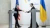 U.S. Secretary of State Antony Blinken, left, steps forward to shake hands with Ukrainian Foreign Minister Dmytro Kuleba during a press conference in Kyiv, Ukraine, May 15, 2024. (Brendan Smialowski/Pool Photo via AP)