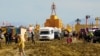 The Man structure, which is normally burned on Saturday night, looms over the Burning Man encampment after a severe rainstorm left tens of thousands of revelers stranded in mud in the Nevada desert, Sept. 3, 2023. (USA Today Network via Reuters)