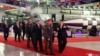 FILE - North Korean leader Kim Jong Un, right, and Russia's Defense Minister Sergei Shoigu visit an exhibition of armed equipment in this image released by North Korea's Korean Central News Agency on July 27, 2023. (KCNA via Reuters) 