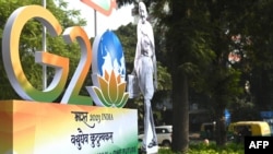ভারতের নয়াদিল্লিতে আনুষ্ঠানিকভাবে জি-২০ লোগোটি উন্মোচন করা হয়। ১ ডিসেম্বর ২০২২ (ছবি- মানি শর্মা / এএফপি) 