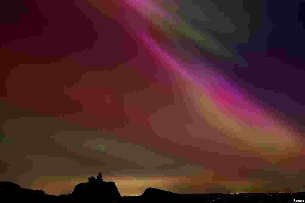 The aurora borealis are seen over The Roaches near Leek, Staffordshire, Britain, May 10, 2024.