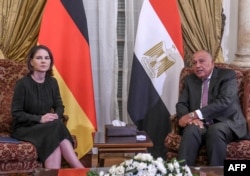 Egyptian Foreign Minister Sameh Shoukry, right, meets with his German counterpart Annalena Baerbock at Tahrir Palace in Cairo on Oct. 14, 2023. Baerbock traveled to Israel on Oct. 13, 2023.
