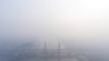 A view shows the Ampera bridge covered with smog due to wildfires in Palembang, South Sumatra province, Indonesia, Oct. 1, 2023, in this photo taken by Antara Foto. (Antara Foto/Nova Wahyudi/via Reuters) 
