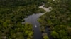 FILE - Aerial view of a boat on the Jurura river in Brazil, March 15, 2020. A team of scientists is using bioacoustics and artificial intelligence to learn more about animal life and habitats in the tropics.