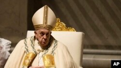 Pope Francis presides over the Easter vigil celebration in St. Peter's Basilica at the Vatican, March 30, 2024.