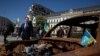 Britain's Foreign Secretary David Cameron walks past a display of destroyed Russian military vehicles in Saint Michael's Square, amid Russia's attack on Ukraine, in Kyiv, Ukraine, May 2, 2024.