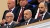 FILE - Milan Radoicic (C), Serb List leader Goran Rakic (L) and former mayor of the Serb part of the ethnically divided town of Mitrovica Milan Radojevic attend a session of parliament, in Belgrade, Feb. 2, 2023. 