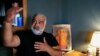 FILE - Writer Khaled Khalifa speaks during an interview with AFP at his home in the Syrian capital of Damascus, June 2, 2020.