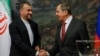 FILE - Russian Foreign Minister Sergey Lavrov, right, and Iranian Foreign Minister Hossein Amir-Abdollahian shake hands after a joint news conference following their talks in Moscow, Russia, March 29, 2023. Lavrov is to visit Tehran for talks Monday.