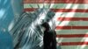 FILE - A woman walks past a satirized painting of the Statue of Liberty on the wall of the former U.S. Embassy, in Tehran, April 24, 2008. An Iranian court on Oct. 26, 2023, told the U.S. government to compensate victims of a failed 1980 hostage rescue effort at the embassy. 