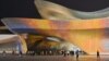 People walk outside the Chengdu Science Fiction Museum during Worldcon, the World Science Fiction Convention, in Chengdu, in China’s southwest Sichuan province, Oct. 21, 2023.