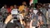 Kemi Seba, a Franco-Beninese firebrand pro-Russia activist, speaks to supporters of the junta that seized power in Niger in July, during a rally near the French military base, calling for the withdrawal of French forces, in Niamey, Niger, Sept. 28,2023.