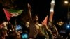 People chant anti-Israel slogans while waving Palestinian flags during a rally celebrating the attacks that the militant Hamas group carried out against Israel, in Istanbul, Turkey, Oct. 7, 2023. 