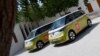 Volkswagen ID. Buzz vehicles are parked outside the venue hosting the Geneve International Motor Show (GIMS) in Doha on Oct. 1, 2023, after crossing through 12 countries to arrive in Qatar from Geneva. 