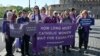 FILE - Supporters of Women's Ordination Conference (WOC), demonstrate to advocate and pray for the ordination of women near the Vatican in Rome, on Oct. 6, 2023.