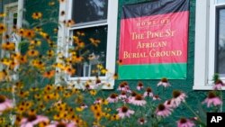 A sign marks the location of a recently rediscovered African burial ground in Kingston, NY, Aug. 5, 2024. 